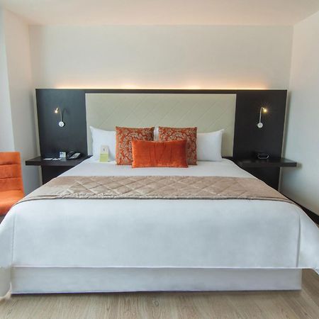 Four Points By Sheraton Cuenca Luaran gambar A bedroom at the hotel